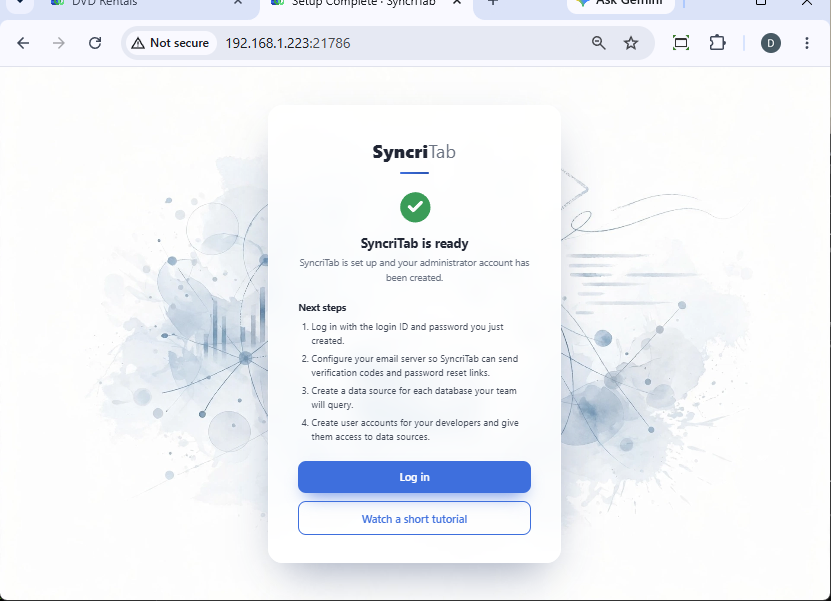 The SyncriTab is ready page with a list of next steps and the Log in and Watch a short tutorial buttons.